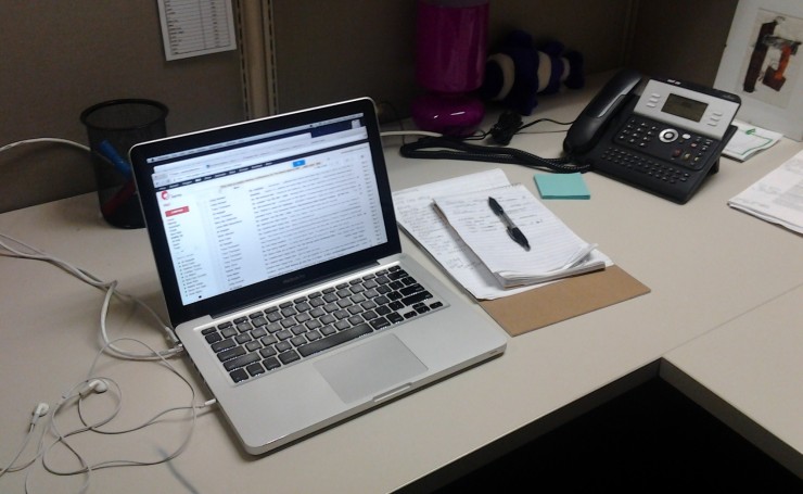This is what my cubicle looks like at the beginning of a day of writing copy at the office. 
